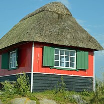 Reetgedecktes Strandhäuschen